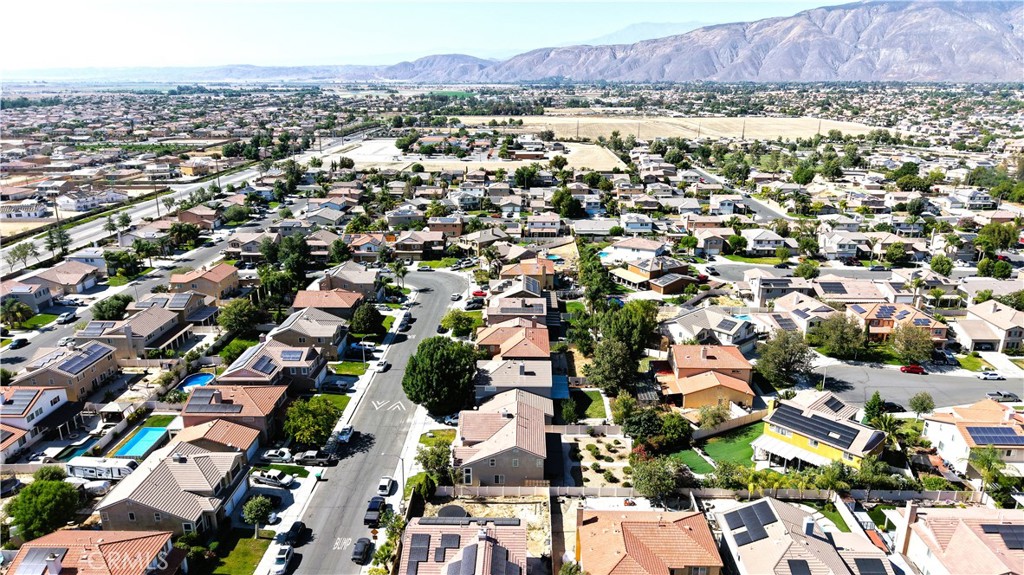 1279 Longbranch Road San Jacinto, CA 92582 - Photo 33 of 35 an aerial view of residential houses with outdoor space and parking