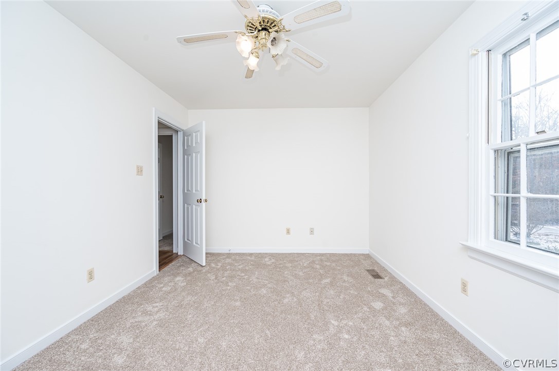 13530 Spring Run Road Midlothian, VA 23112 - Photo 24 of 41 an empty room with windows and fan