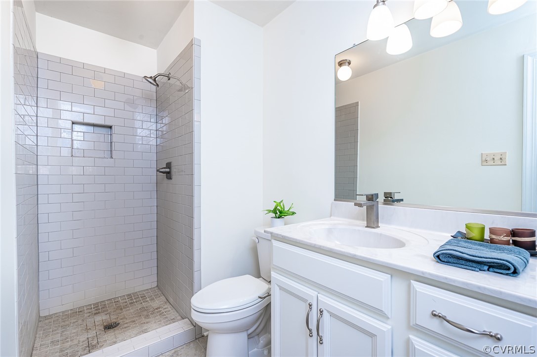 13530 Spring Run Road Midlothian, VA 23112 - Photo 30 of 41 a bathroom with a sink a toilet and shower