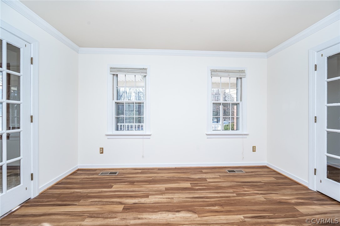 13530 Spring Run Road Midlothian, VA 23112 - Photo 6 of 41 a view of an empty room with window and wooden floor