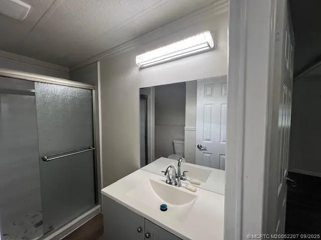 a bathroom with a sink and mirror