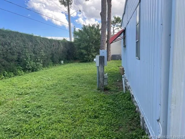 a view of a yard in front of a house
