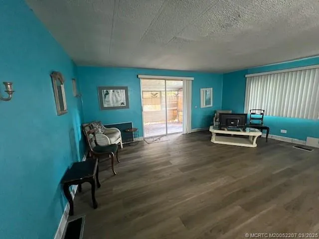 a living room with furniture and a chair