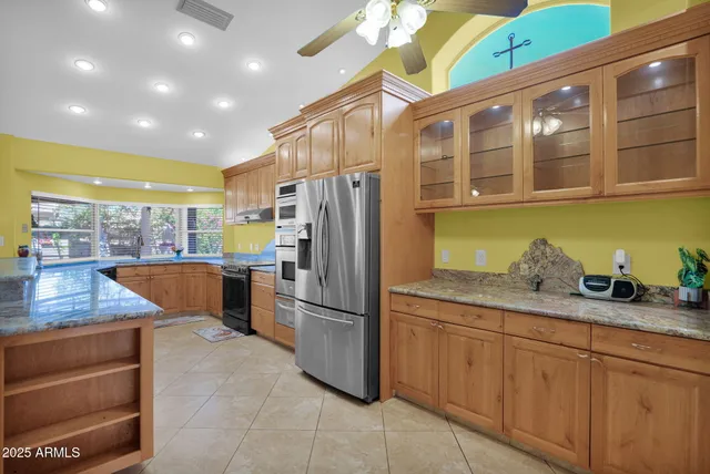 a kitchen with sink and cabinets