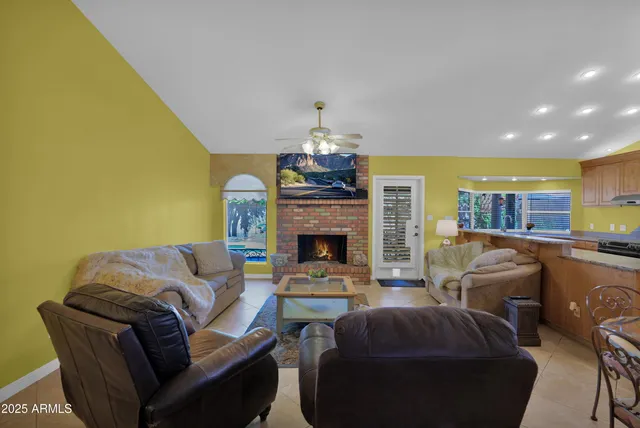 a bedroom with a bed and large window