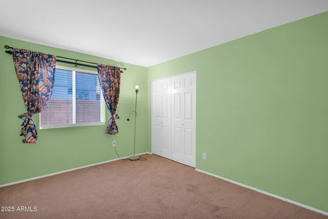 a view of an outdoor dining space with a table and chairs