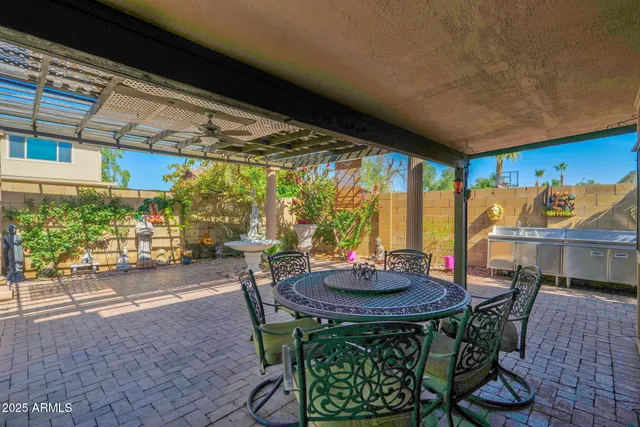 a view of a backyard with a patio