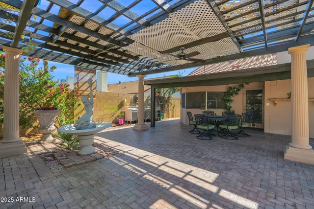 a view of a swimming pool with a patio