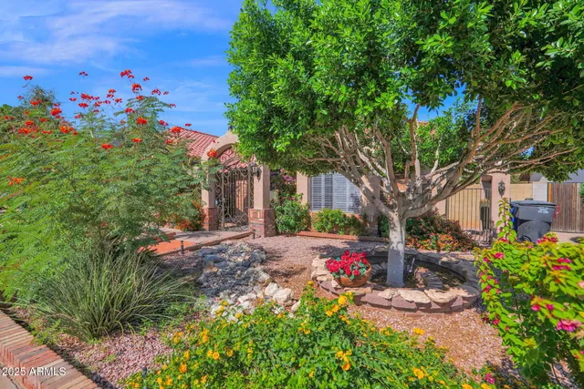 a front view of a house with garden