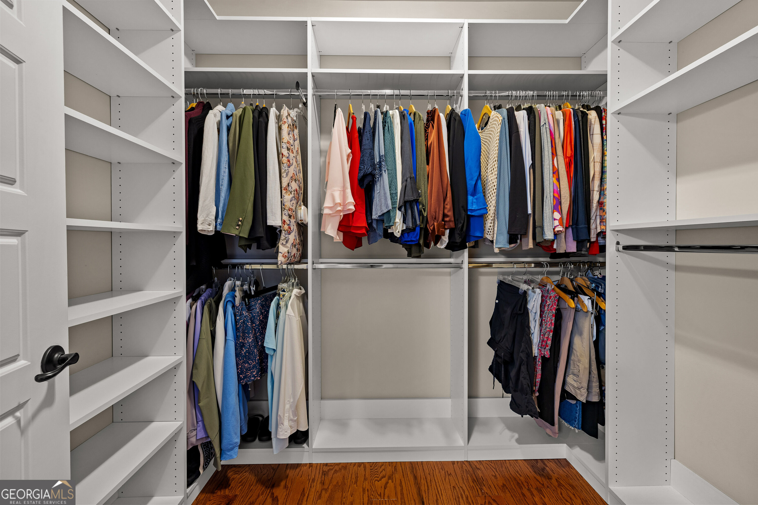 12 Delaware Way Newnan, GA 30265 - Photo 34 of 61 Primary walk-in closet with built-in shelving and ample hanging space.