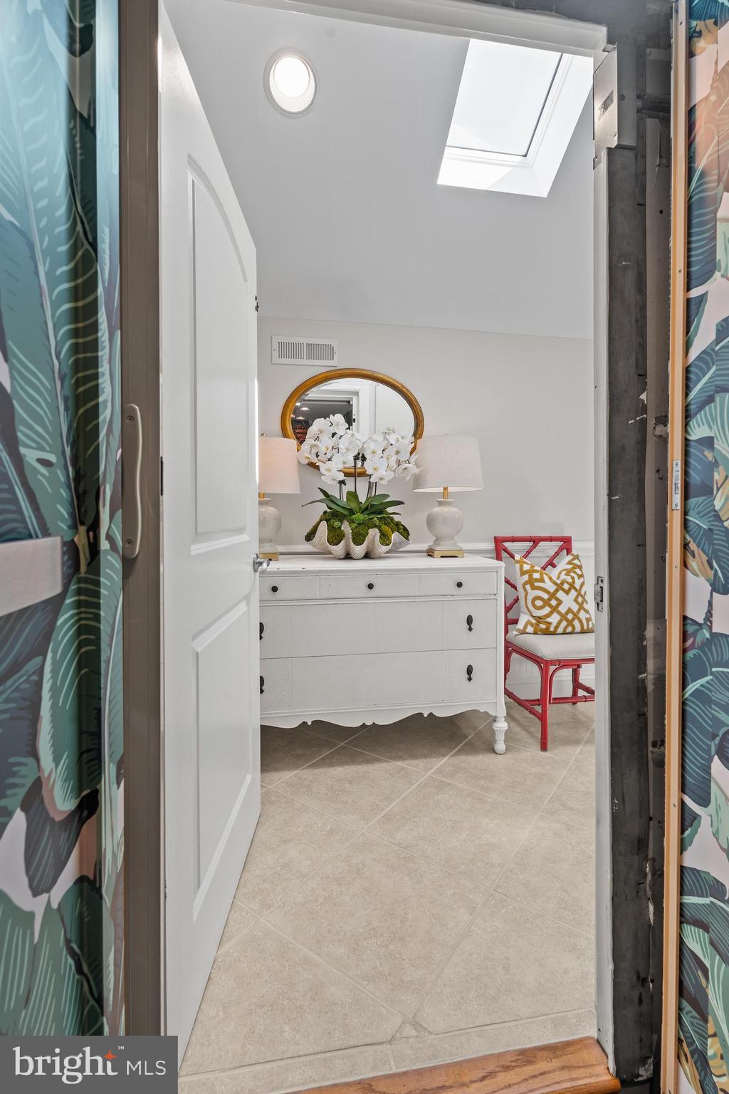 37304 Lighthouse Road, Unit 10 Selbyville, DE 19975 - Photo 17 of 40 a living room with a couch and a table