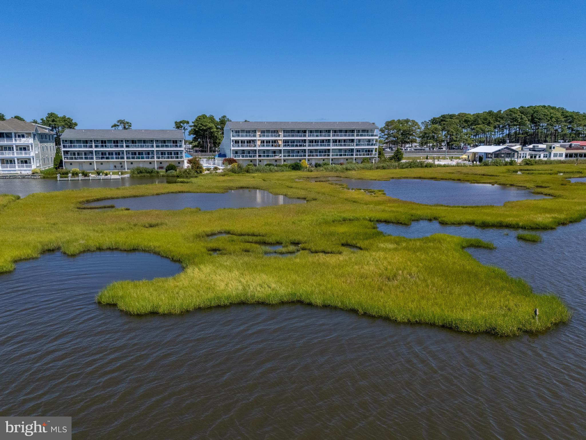 37304 Lighthouse Road, Unit 10 Selbyville, DE 19975 - Photo 7 of 40 a view of a swimming pool with an ocean view