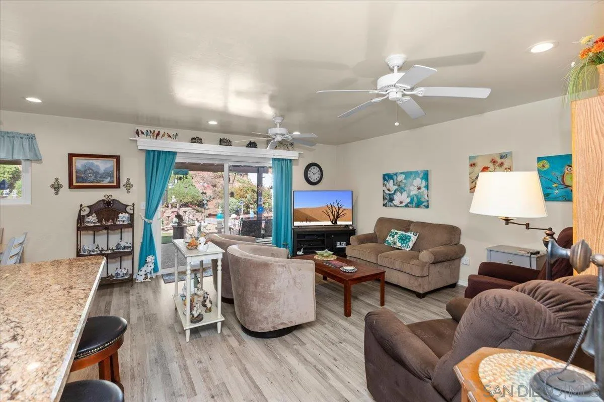 9254 Shadow Hill Road Santee, CA 92071 - Photo 5 of 34 a living room with furniture and a flat screen tv