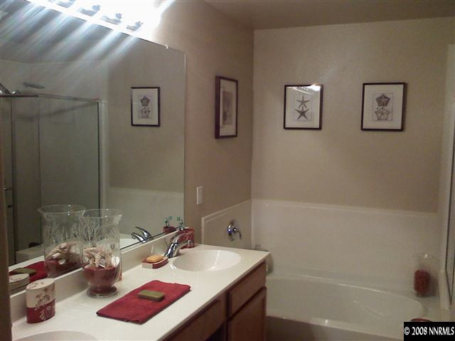 17000 Wedge Parkway, Unit 125 Reno, NV 89511 - Photo 6 of 7 a bathroom with a sink and a mirror