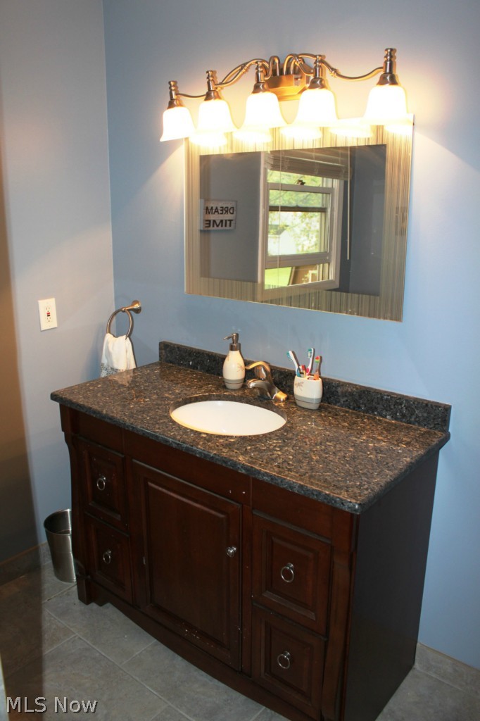 3232 Walter Road Westlake, OH 44145 - Photo 10 of 23 Main Bath has been remodeled to include this stylish vanity and ceramic tile floor!