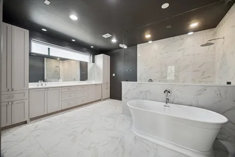 a bathroom with a double vanity sink and a mirror
