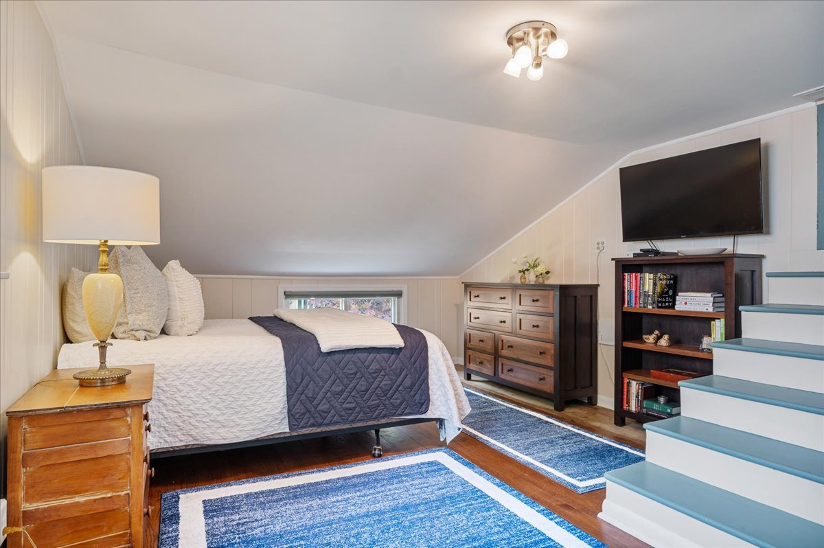 630 Long Road Glenview, IL 60025 - Photo 12 of 24 a bedroom with furniture and a flat screen tv