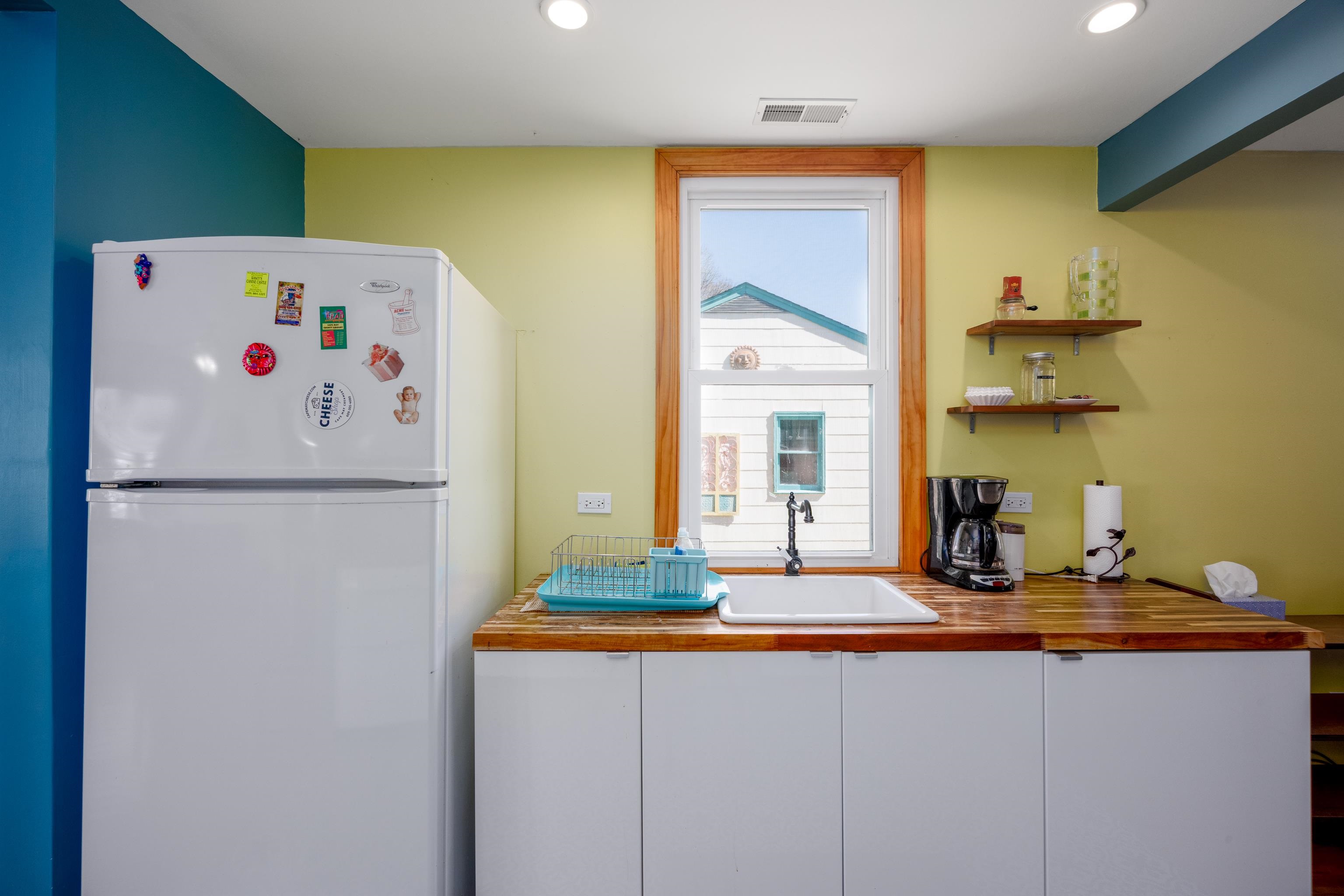 107 Avalon Road Cape May, NJ 08204 - Photo 7 of 25 a kitchen with a refrigerator and a sink
