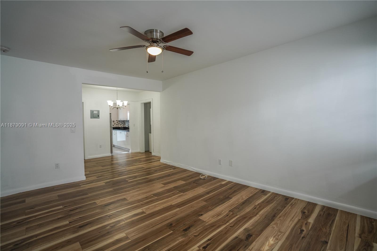 1120 Euclid Avenue, Unit 14 Miami Beach, FL 33139 - Photo 3 of 9 a view of an empty room and wooden floor