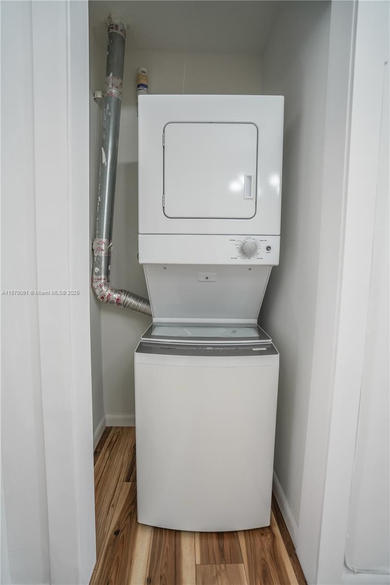 1120 Euclid Avenue, Unit 14 Miami Beach, FL 33139 - Photo 8 of 9 a utility room with dryer and washer