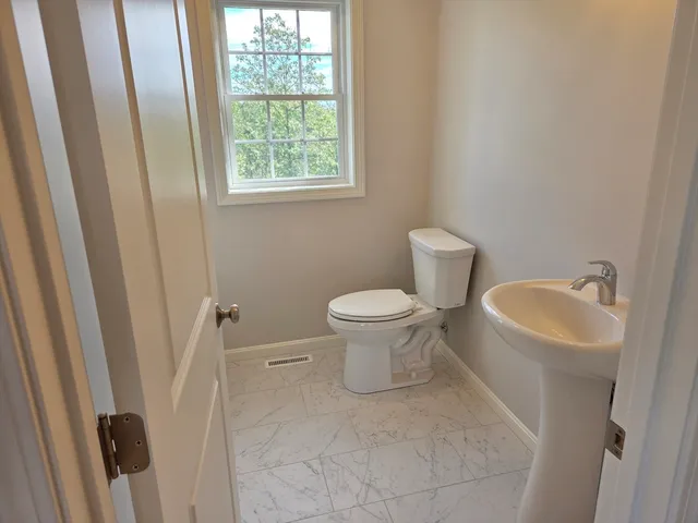 a bathroom with a sink and a toilet