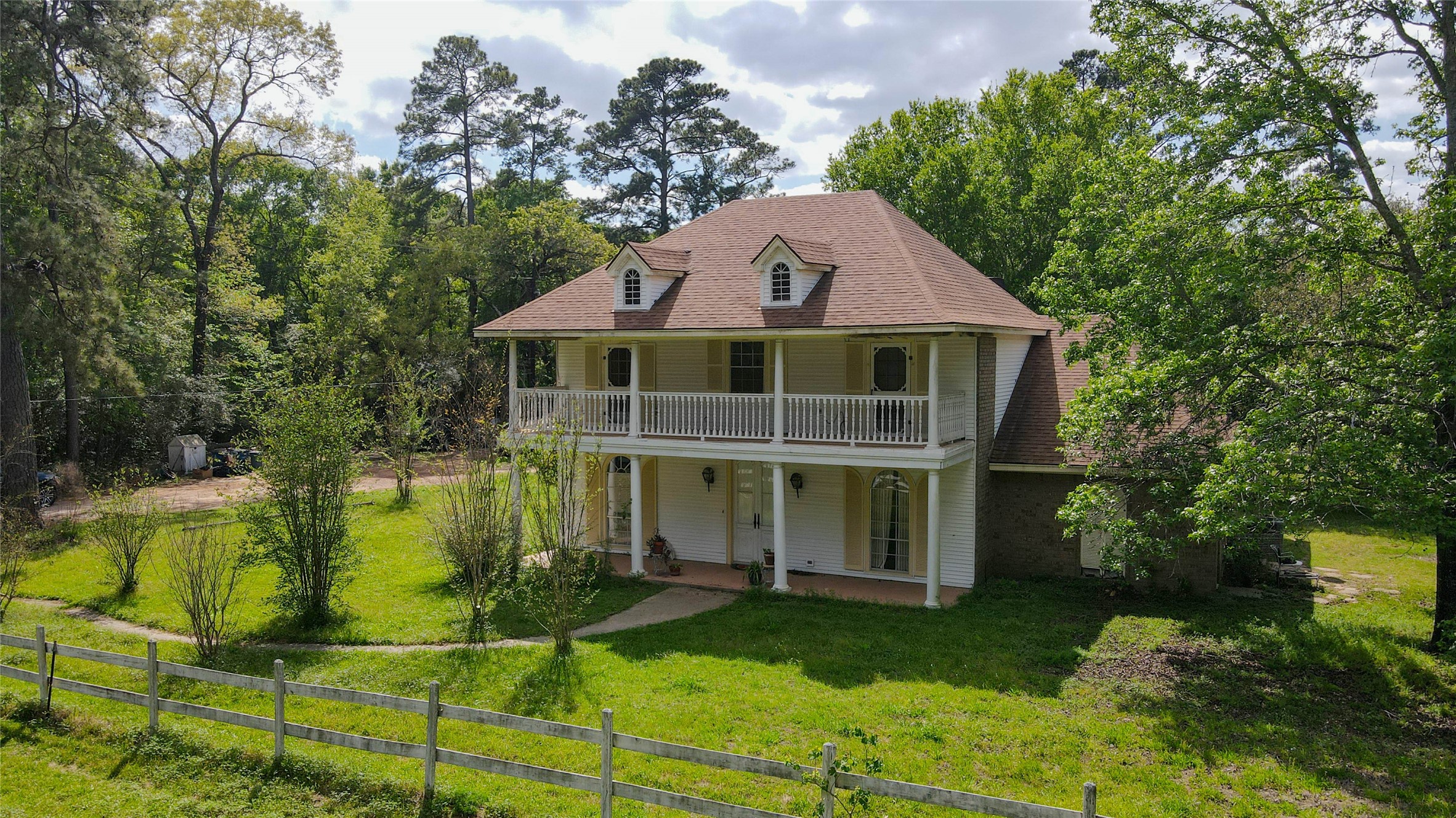 32037 Dobbin-Huffsmith Road Magnolia, TX 77354 - Photo 1 of 49 a front view of a house with a yard