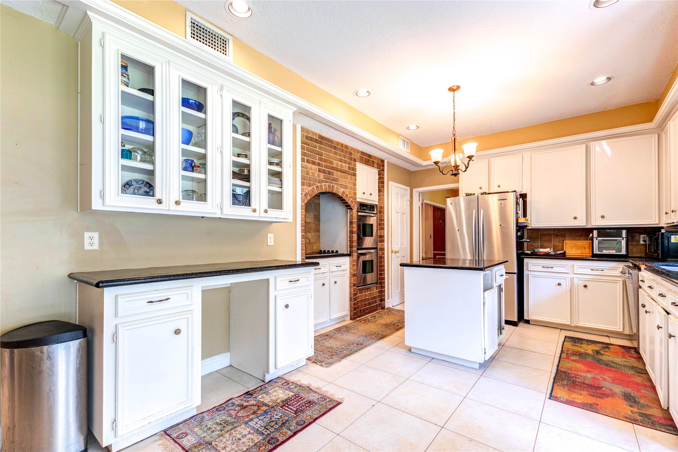32037 Dobbin-Huffsmith Road Magnolia, TX 77354 - Photo 14 of 49 a kitchen with refrigerator and window