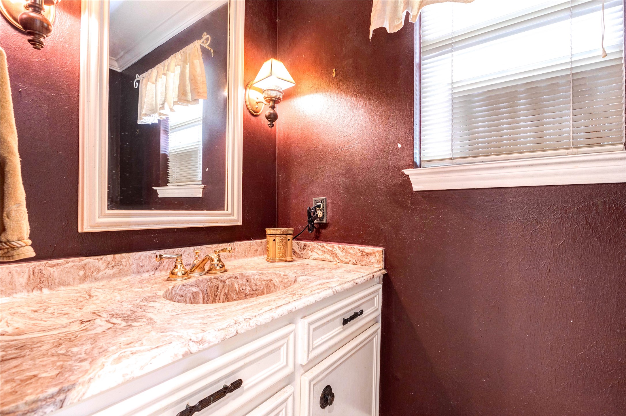 32037 Dobbin-Huffsmith Road Magnolia, TX 77354 - Photo 16 of 49 a bathroom with a sink and a mirror