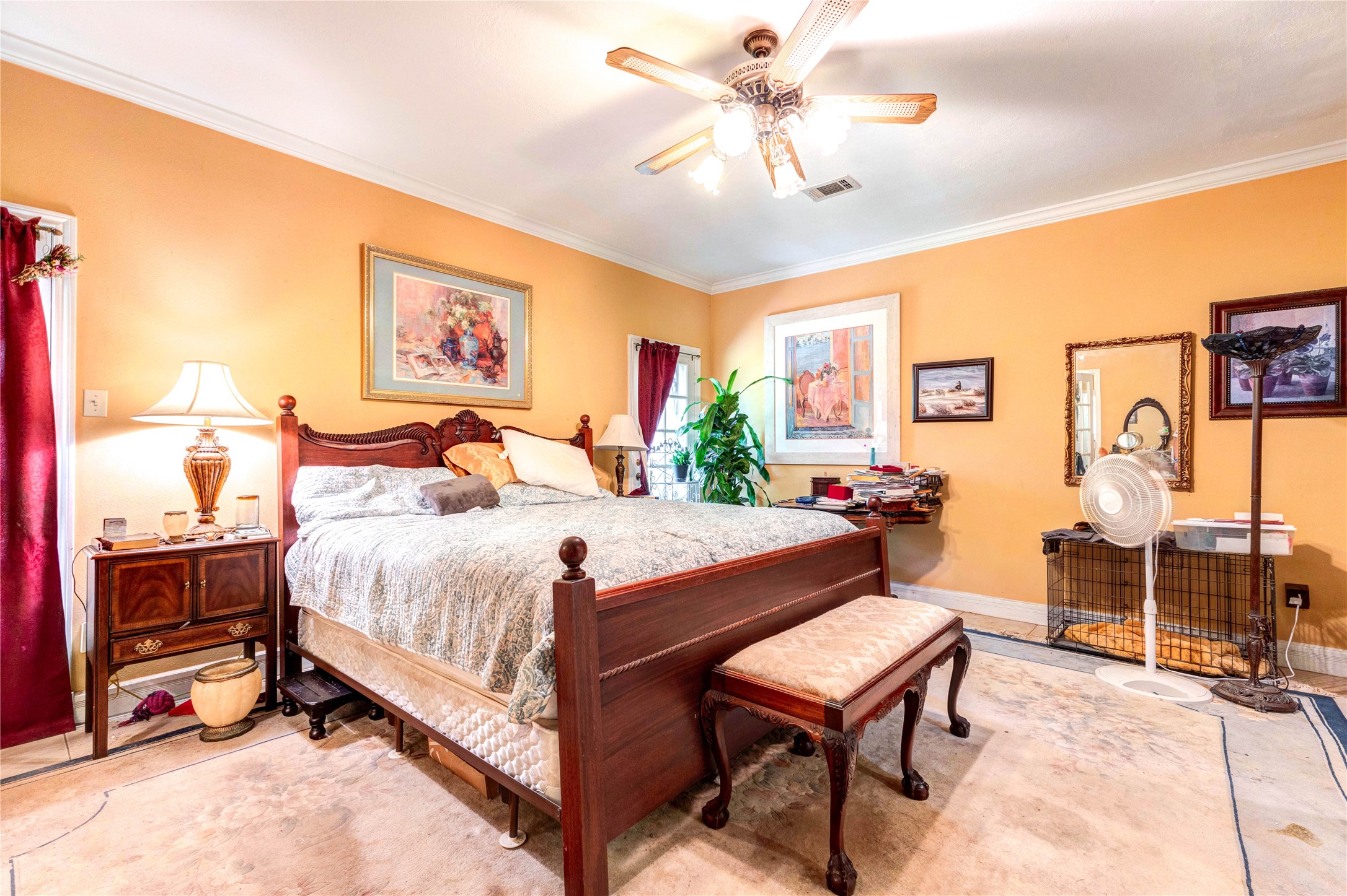 32037 Dobbin-Huffsmith Road Magnolia, TX 77354 - Photo 22 of 49 a bedroom with a bed and a chandelier