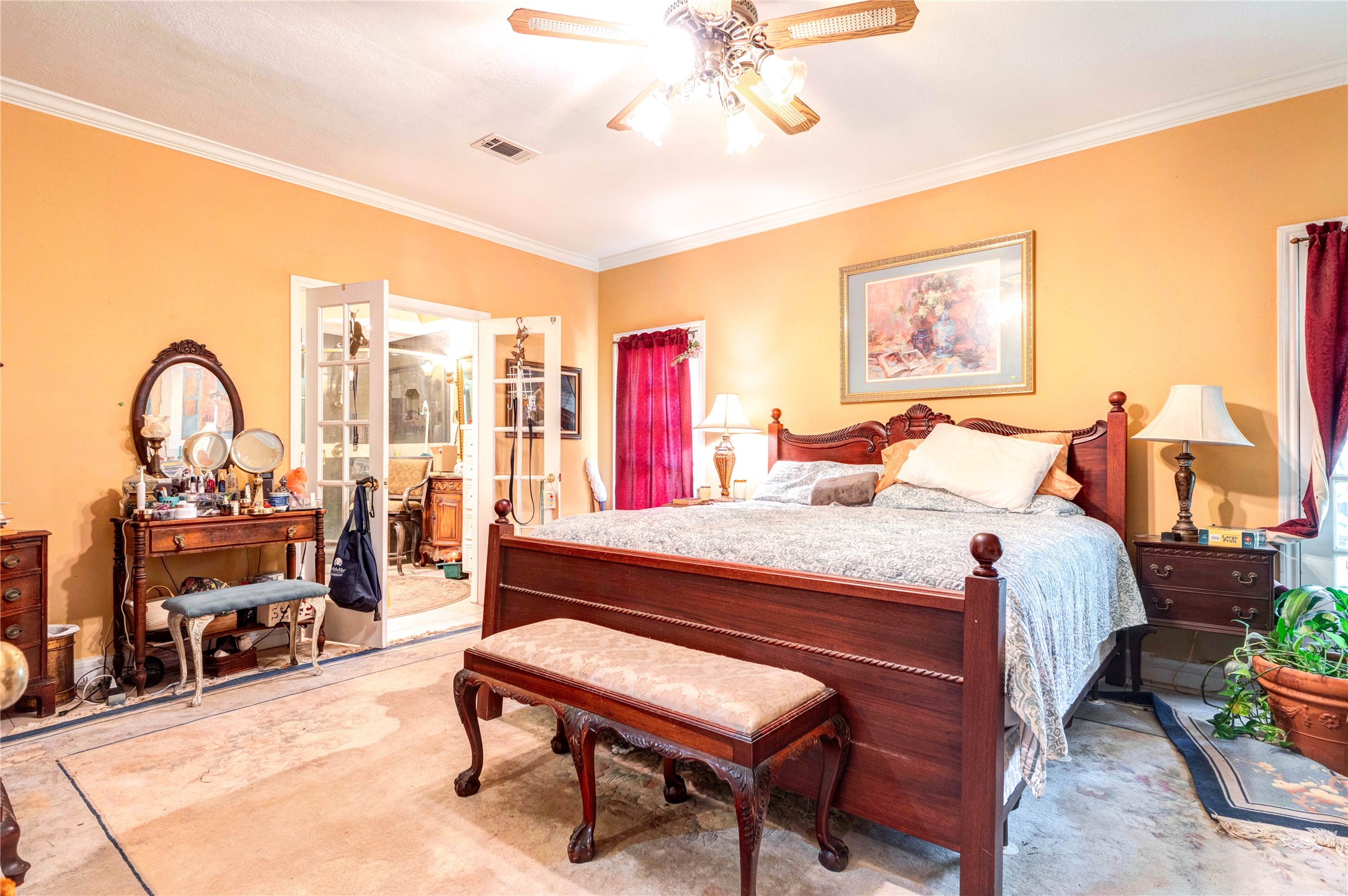 32037 Dobbin-Huffsmith Road Magnolia, TX 77354 - Photo 23 of 49 a bedroom with a bed a bookshelf and a potted plant