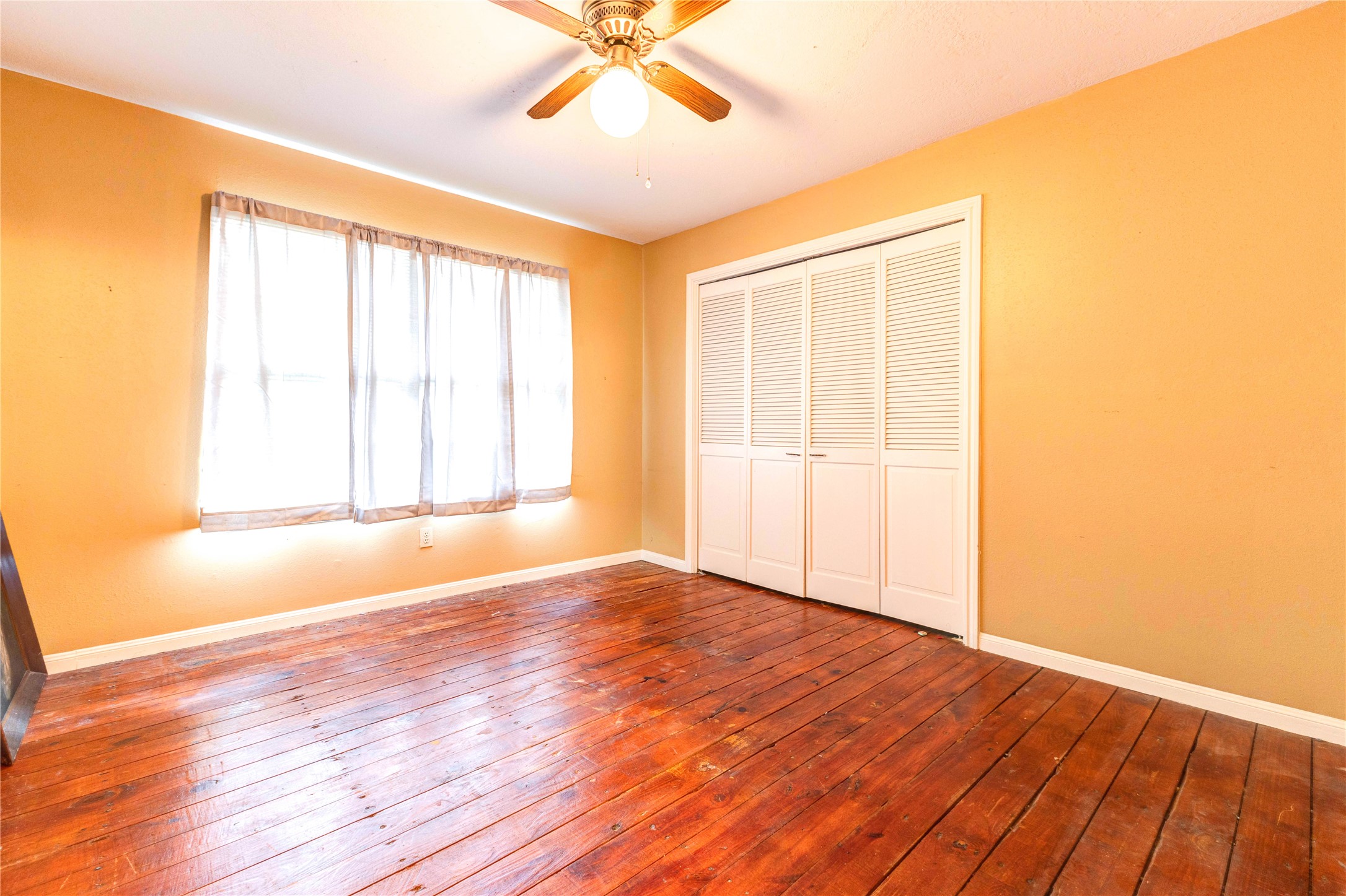 32037 Dobbin-Huffsmith Road Magnolia, TX 77354 - Photo 28 of 49 an empty room with wooden floor and windows