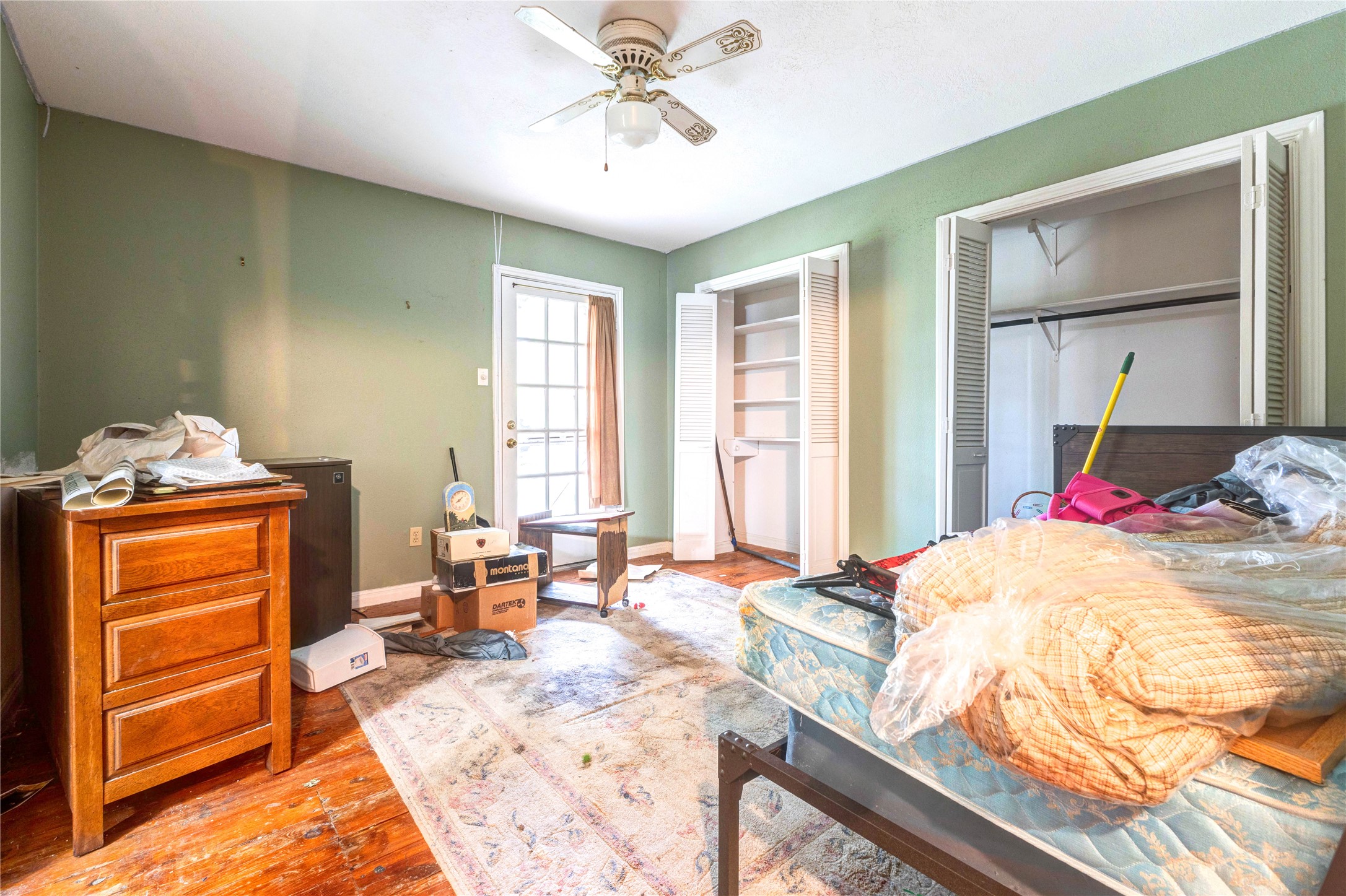 32037 Dobbin-Huffsmith Road Magnolia, TX 77354 - Photo 30 of 49 a bedroom with a bed and wooden floor