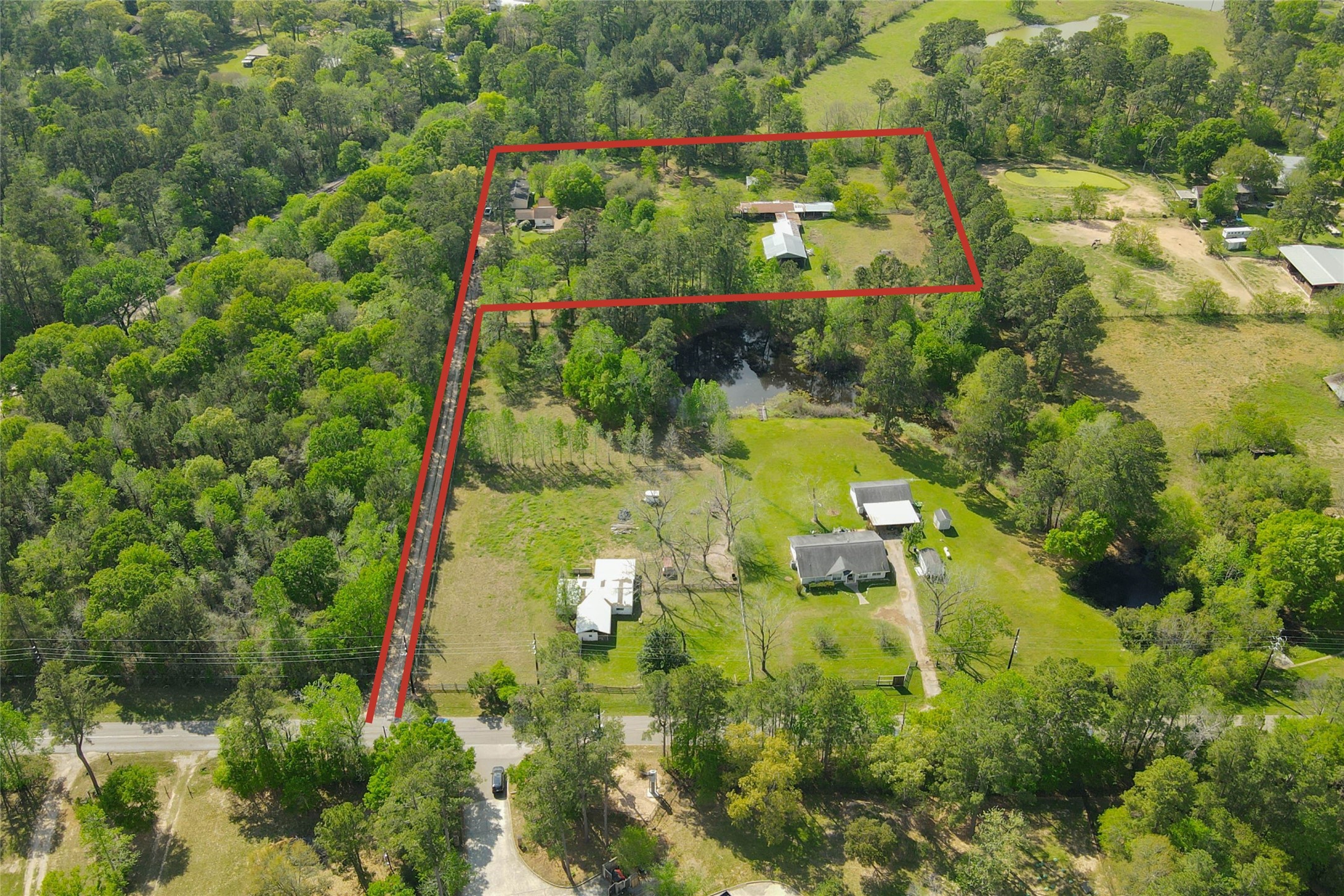 32037 Dobbin-Huffsmith Road Magnolia, TX 77354 - Photo 3 of 49 an aerial view of residential houses with outdoor space and trees all around
