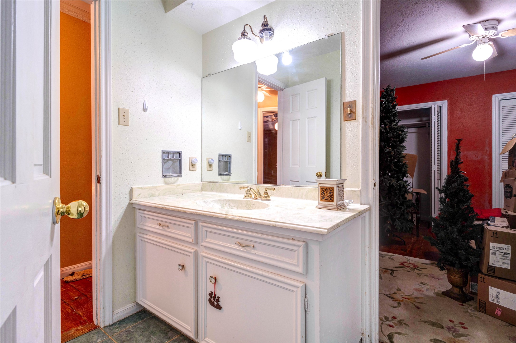 32037 Dobbin-Huffsmith Road Magnolia, TX 77354 - Photo 32 of 49 a bathroom with a sink vanity and a mirror