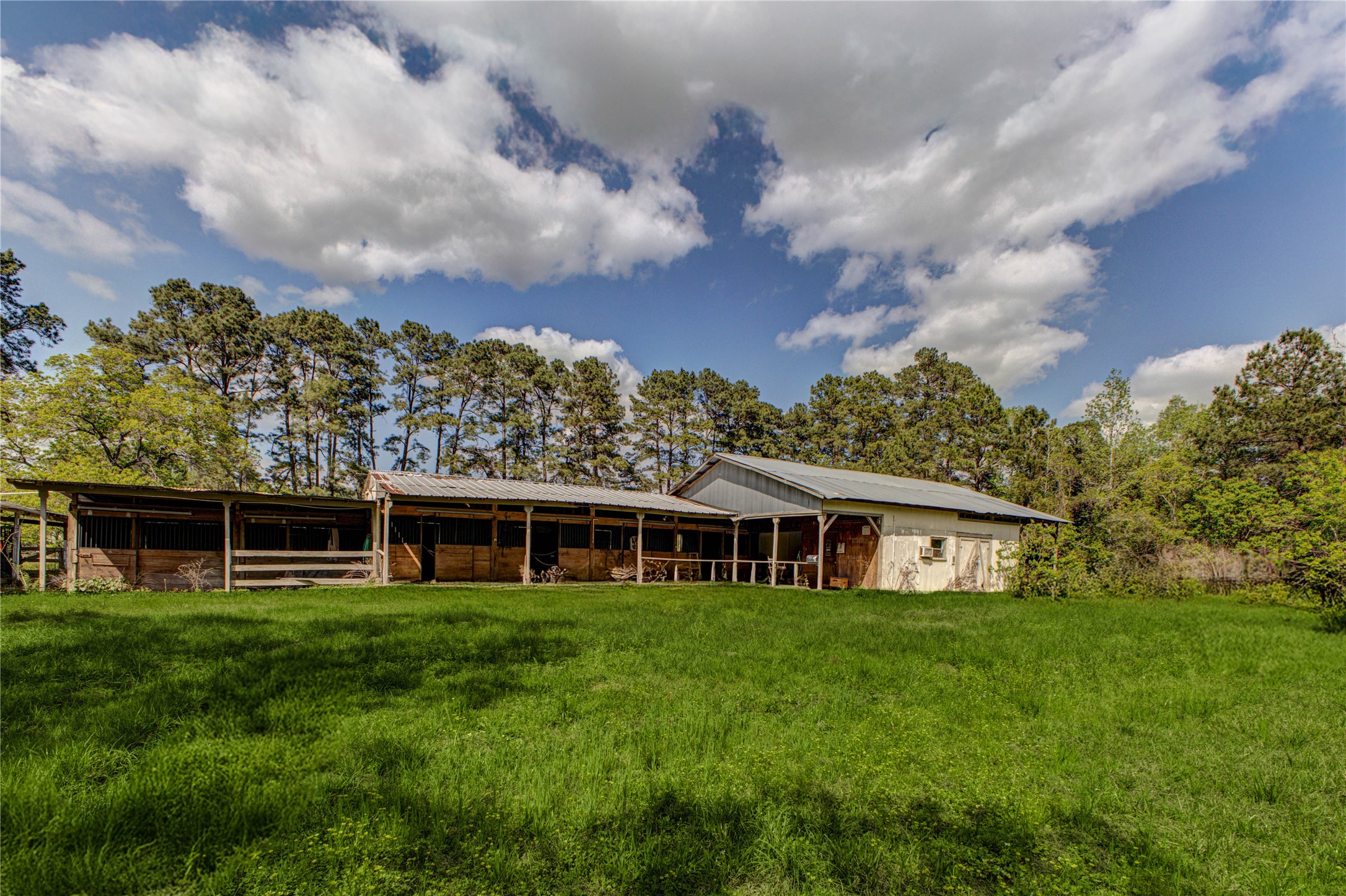 32037 Dobbin-Huffsmith Road Magnolia, TX 77354 - Photo 39 of 49 a view of a house with a yard and sitting area