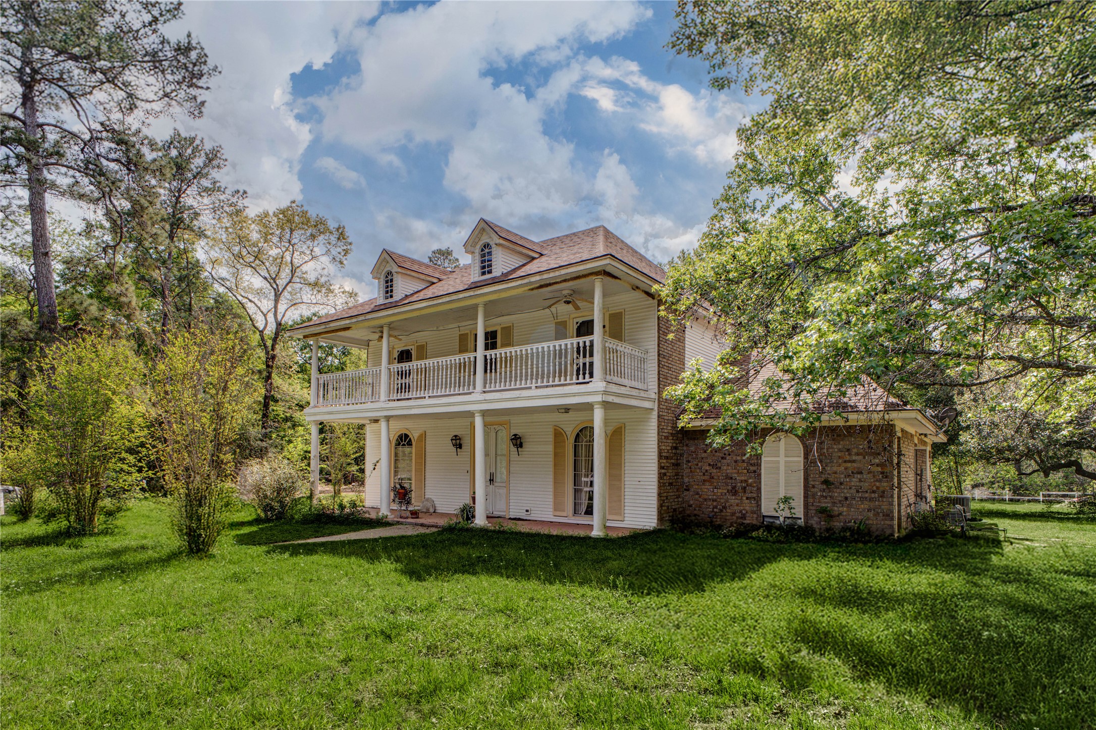 32037 Dobbin-Huffsmith Road Magnolia, TX 77354 - Photo 4 of 49 a view of a house with a garden