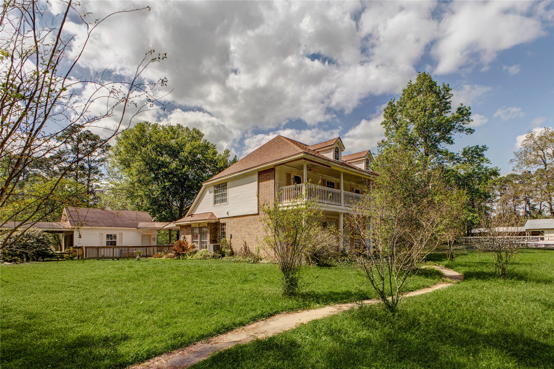 32037 Dobbin-Huffsmith Road Magnolia, TX 77354 - Photo 43 of 49 a front view of a house with a garden