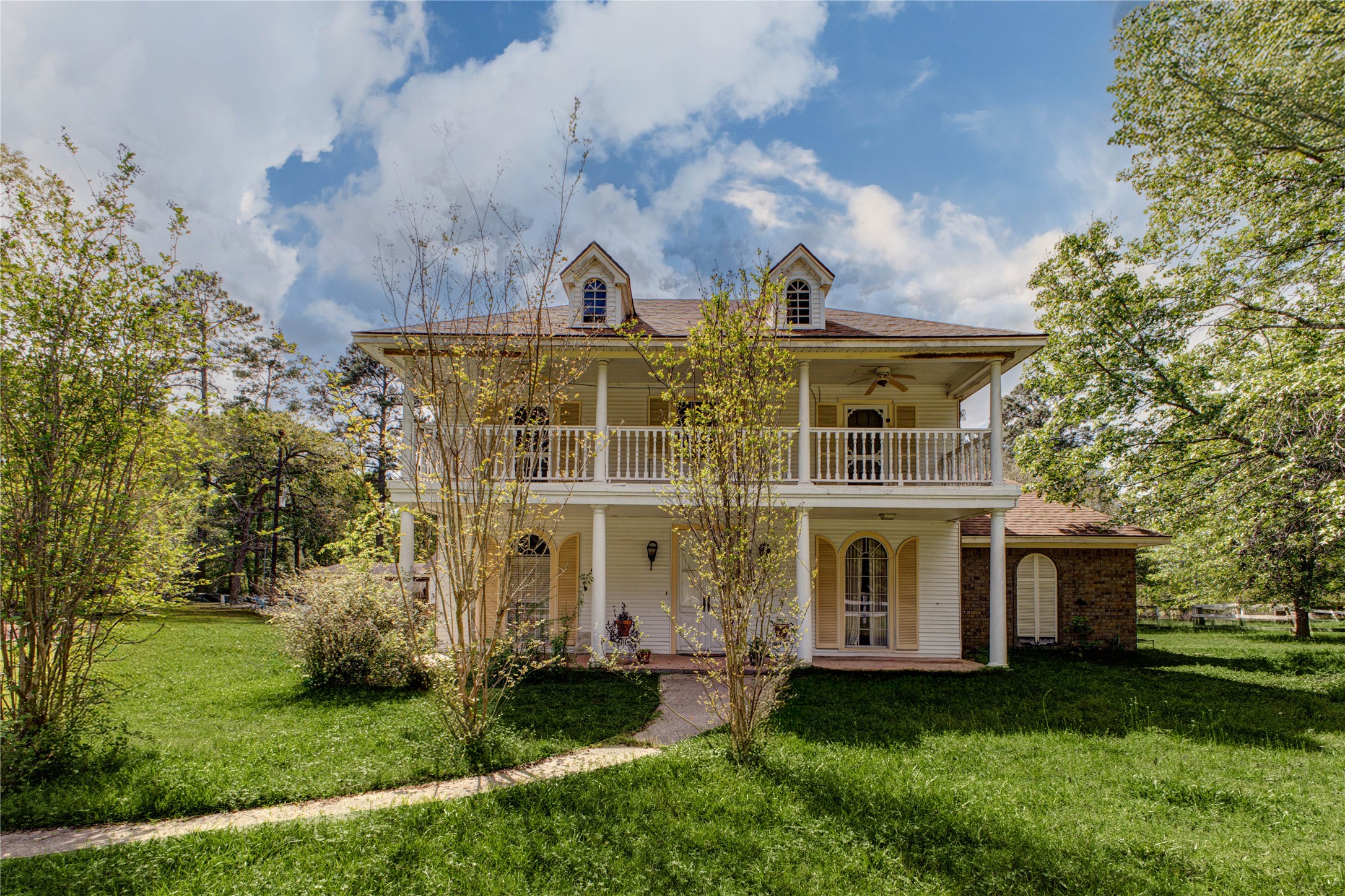 32037 Dobbin-Huffsmith Road Magnolia, TX 77354 - Photo 49 of 49 a front view of a house with a garden