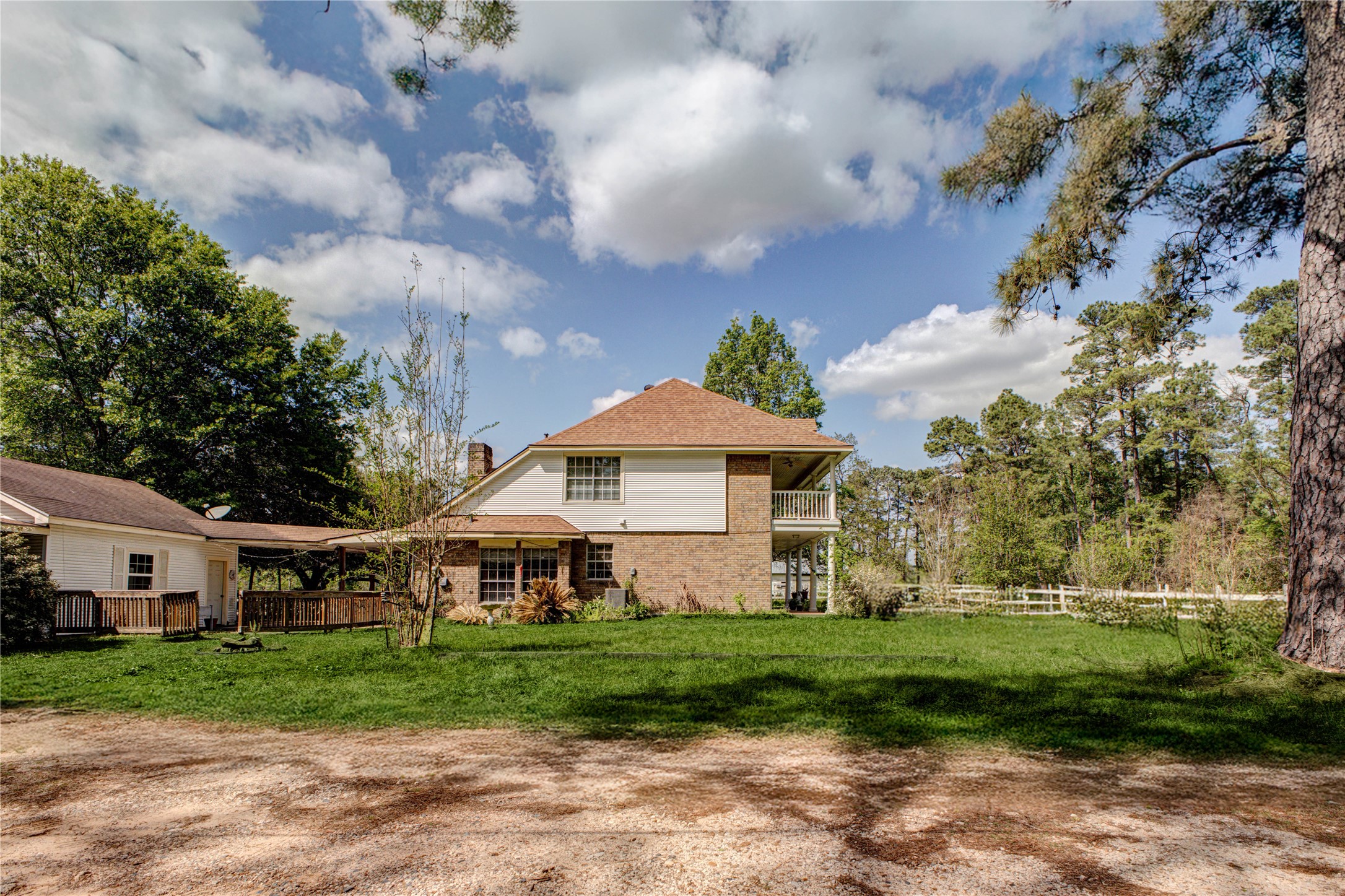 32037 Dobbin-Huffsmith Road Magnolia, TX 77354 - Photo 5 of 49 a view of a house with a big yard plants and large trees