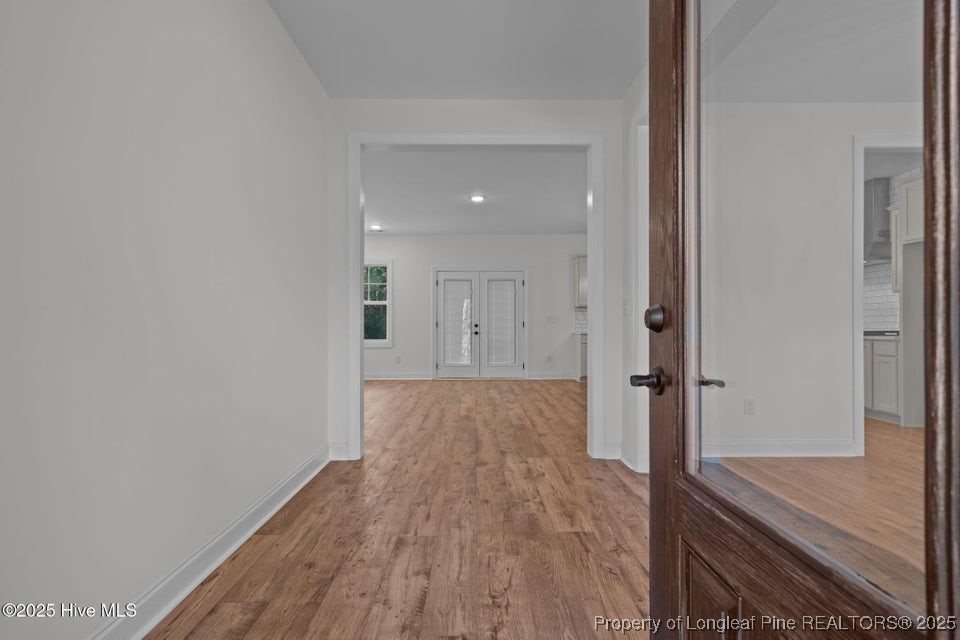150 Hickory Pointer Way Cameron, NC 28326 - Photo 22 of 50 a view of hallway with wooden floor