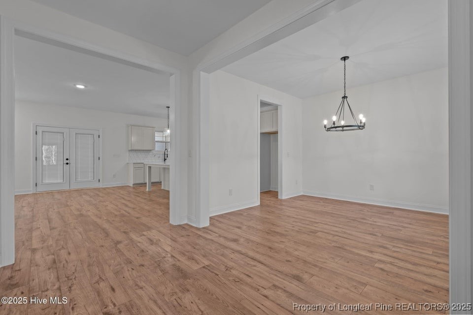 150 Hickory Pointer Way Cameron, NC 28326 - Photo 23 of 50 a view of empty room with wooden floor and ceiling fan