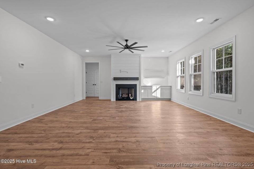 150 Hickory Pointer Way Cameron, NC 28326 - Photo 28 of 50 a view of an empty room with a fireplace and a window