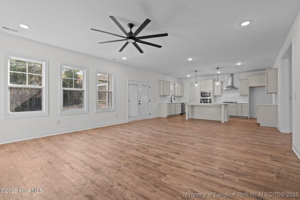 150 Hickory Pointer Way Cameron, NC 28326 - Photo 31 of 50 a view of empty room with wooden floor and window
