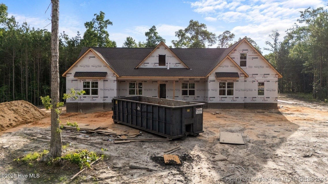 150 Hickory Pointer Way Cameron, NC 28326 - Photo 13 of 50 a view of a house with wooden fence