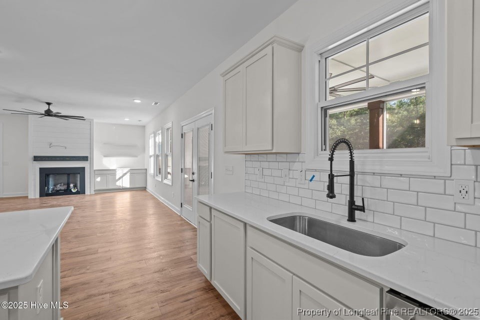 150 Hickory Pointer Way Cameron, NC 28326 - Photo 35 of 50 a kitchen with a sink large window and cabinets