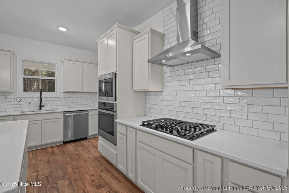150 Hickory Pointer Way Cameron, NC 28326 - Photo 36 of 50 a kitchen with cabinets and stainless steel appliances