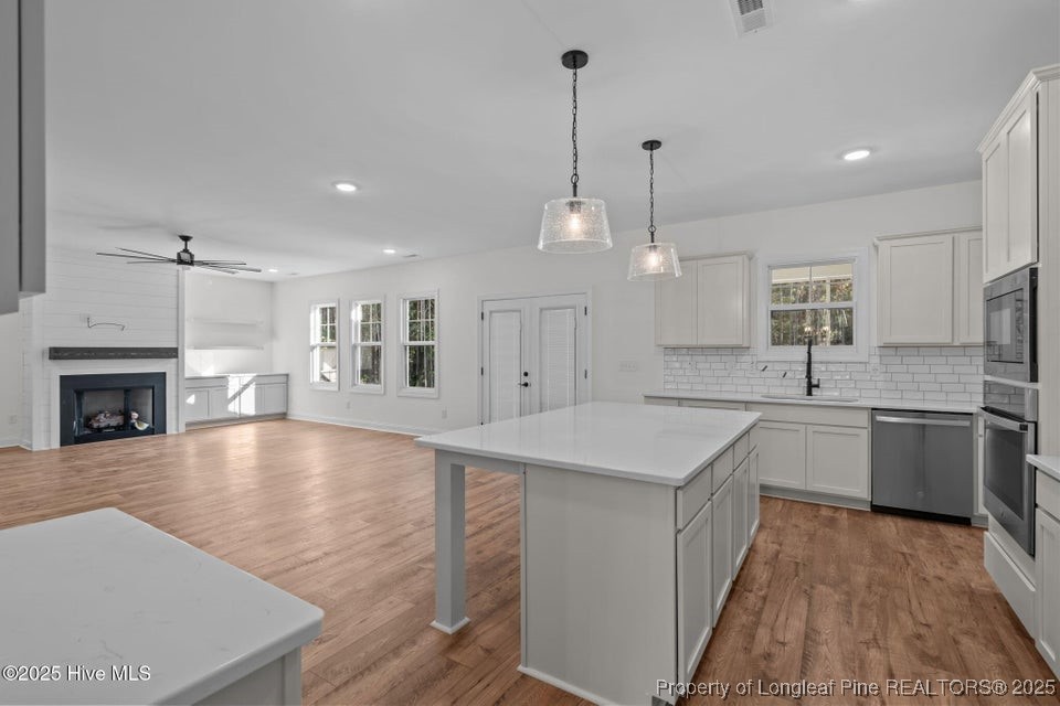 150 Hickory Pointer Way Cameron, NC 28326 - Photo 37 of 50 a large kitchen with kitchen island a sink stainless steel appliances and cabinets
