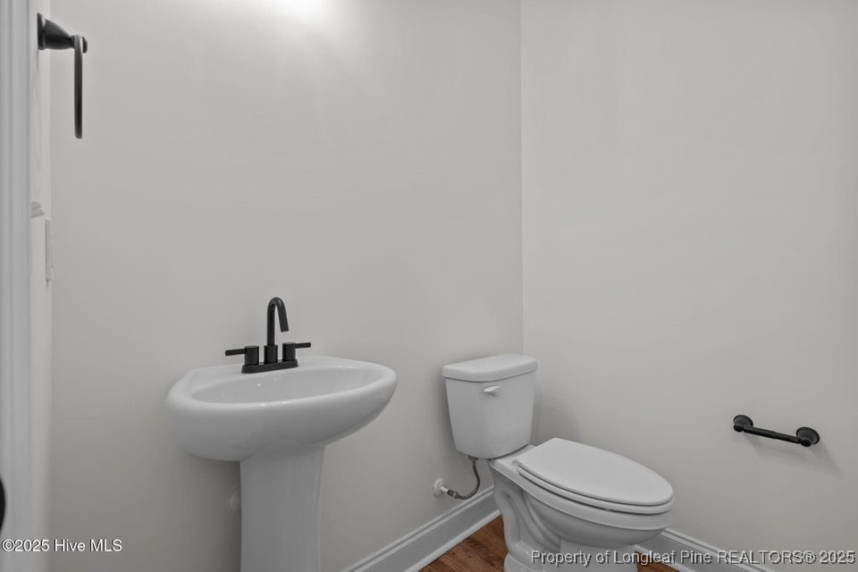 150 Hickory Pointer Way Cameron, NC 28326 - Photo 42 of 50 a bathroom with a toilet sink and mirror