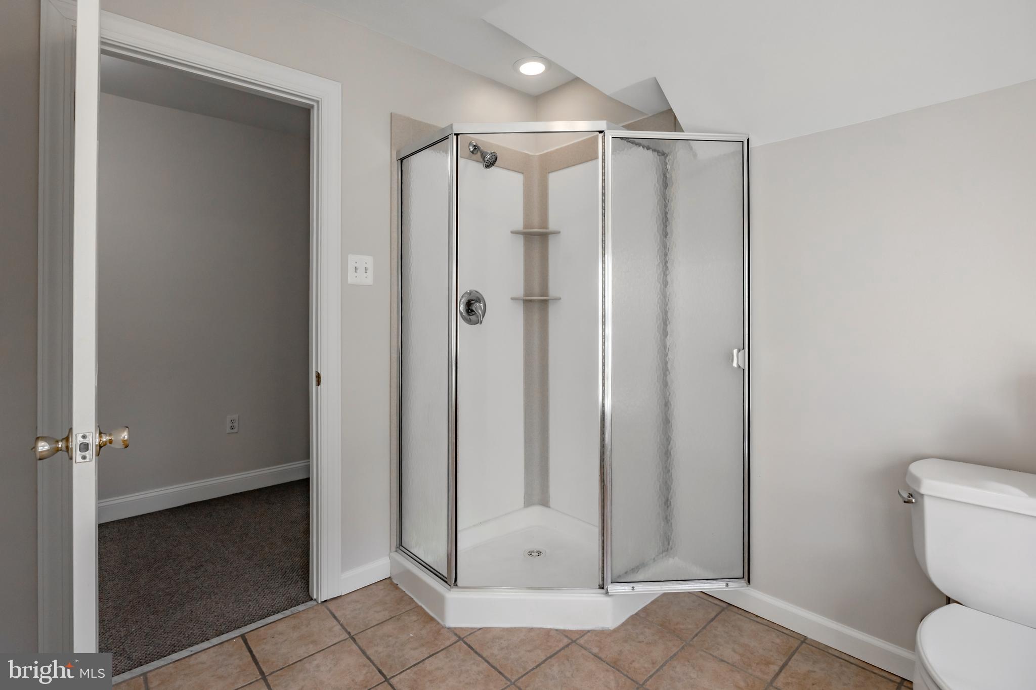 1210 West Darby Road Havertown, PA 19083 - Photo 18 of 33 a bathroom that has a glass shower door