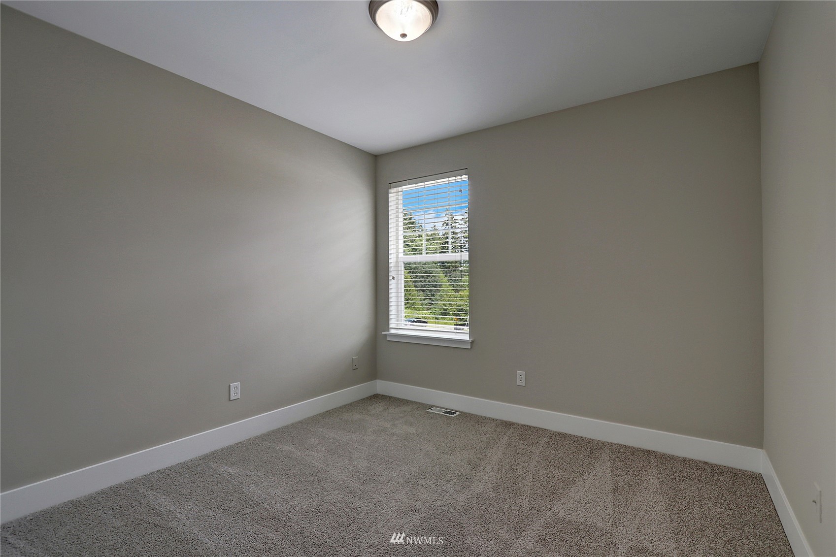 16 228th Street Southeast Bothell, WA 98021 - Photo 21 of 26 an empty room with a window